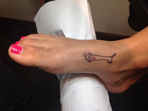 Continuous line dachshund tattoo with heart